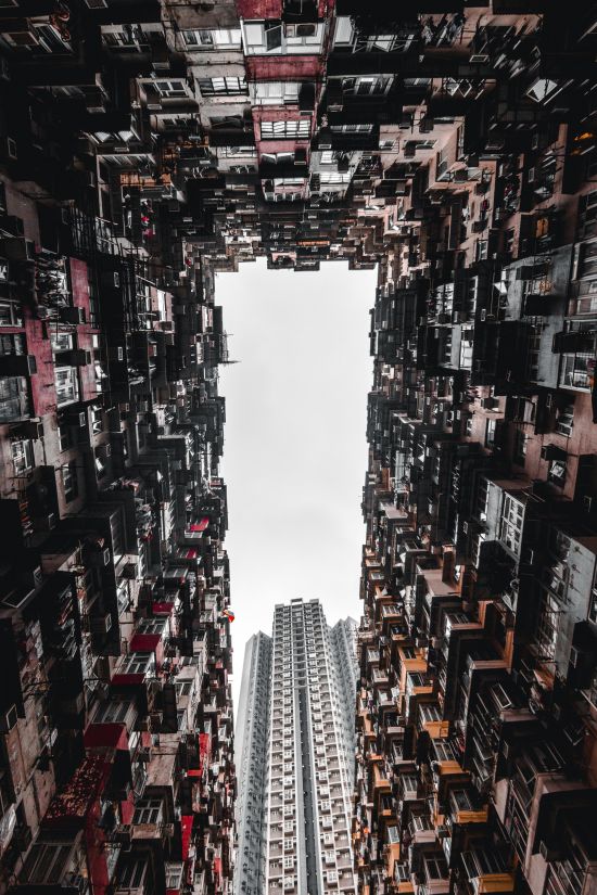 Hong Kong high rise: Many migrate to urban areas and find themselves surrounded by people with whom they have no meaningful relationship (Credit: Alexandr Bormotin/Unsplash)