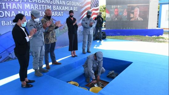 Cementing a longstanding partnership: Indonesian and American officials witness the laying of the foundation stone for the joint Maritime Training Center on Batam Island on June 25, 2021 (Credit: BAKAMLA)