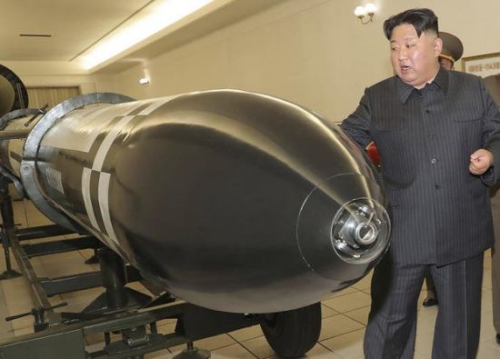North Korean leader Kim Jong-un inspects what is reported to be a new tactical nuclear warhead, March 27: Pyongyang has been ramping up missile tests as the US and South Korean militaries engage in their largest joint exercises since 2017 (Credit: KCNA)