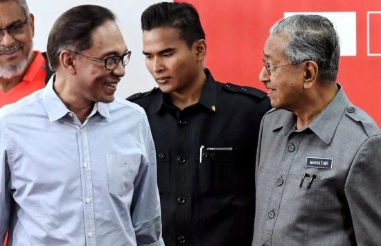 Back together: Mahathir, prime minister once again, and the sucessor-in-waiting that he had sacked two decades earlier, Petaling Jaya, June 2018 (Credit: Bernama)