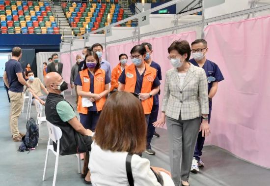 Hong Kong Chief Executive Carrie Lam visits a government vaccination center, April 6, 2021: The path to reopening requires ramping up inoculation rates, particularly among the elderly (Credit: Hong Kong Special Administrative Region Government)