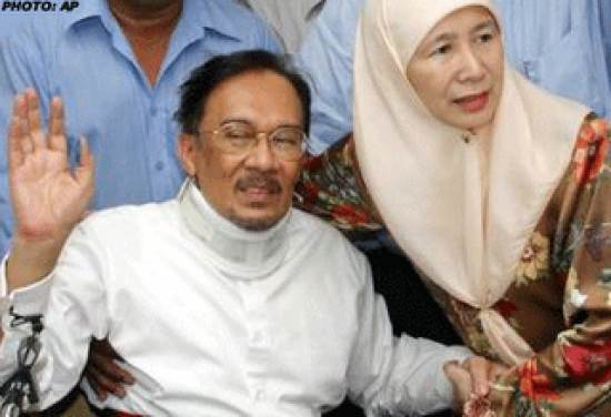 Redemption for a beaten man: Anwar, with wife Wan Azizah Wan Ismail, after his conviction on sodomy and corruption charges was overturned in 2004 (Credit: Twitter)