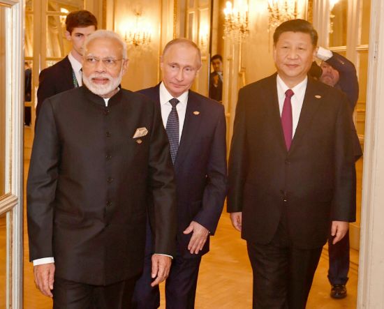 Putin between Indian Prime Minister Narendra Modi and Chinese leader Xi Jinping, Goa, May 2019: Apart from China, India is Russia’s key strategic partner in Asia but Moscow is concerned about Delhi’s membership of the Quad (Credit: YashSD / Shutterstock)