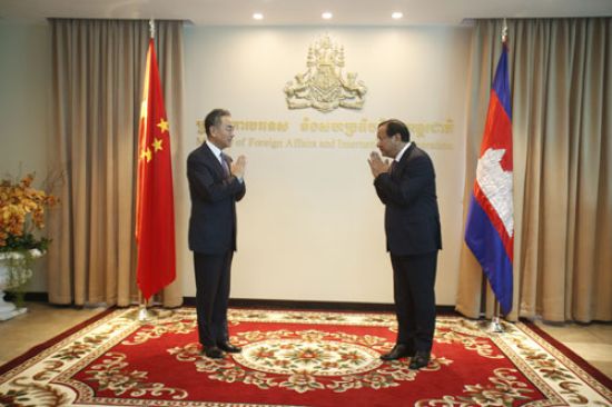 China's Wang Yi (left) in Cambodia: Mask diplomacy has given way to promises of a vaccine (Credit: Ministry of Foreign Affairs of the People's Republic of China)